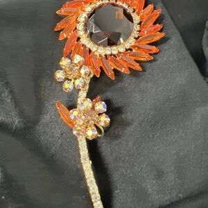 Elegant Sunburst Brooch with Orange and Gold Details
